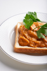 healthy toast with zucchini caviar. Russian traditional sandwich served in a plate with herbs on a white table