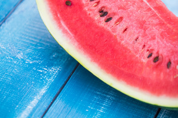 Fototapeta na wymiar Fresh watermelon slice on wooden background