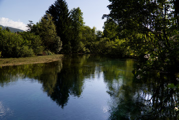 Italy, the splendid deep green waters of the Livenza river