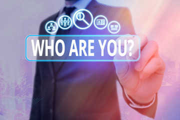 Writing note showing Who Are Youquestion. Business concept for someone asking your an individualal background or history