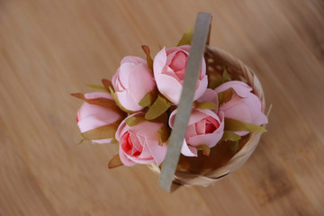 decorated flowers in the basket on isolated background