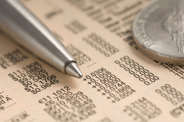 close-up metal ballpoint pen on the background of the financial table