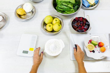 Cooking healthy and tasty fresh. Extracting fruit juice from a juicer