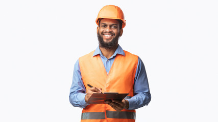 Happy Construction Worker Guy Taking Notes Holding Folder, Studio Shot