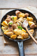 Leftover dinner. Roasted chicken, sausages, potatoes with parsley 