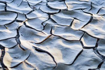 Natural mosaic formed by cracks in dry soil. Dry mud. Background and texture