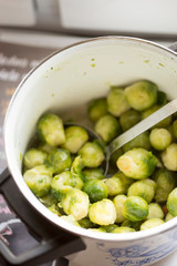 Cooked young brussel sprouts in pot 