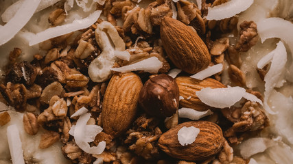 Various delicious nuts. Flat position. Pellet, coconut flakes, nuts. Healthy food