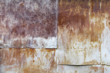 Image of nailed old rusty metal sheets. Wall of old rusty metal sheets. Industrial background. Large view