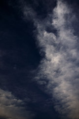 delicate cirrus clouds on the right side of the image, floating under a blue sky.