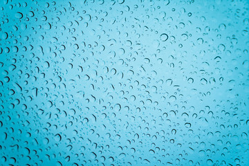 Water drops on the glass. Fogged glass in winter.