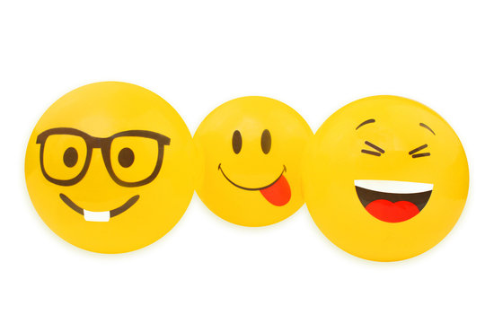 Family of yellow balls with the image of smiles