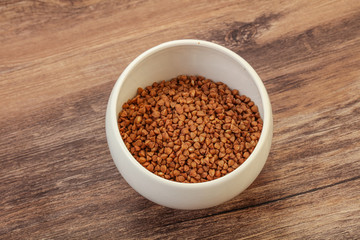 Raw buсkwheat cereal in the bowl