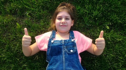 young woman showing thumbs up