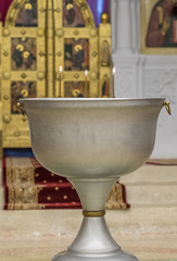 Church font for baptism. Photographed close-up.