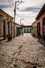 Typical cobblestoned street with colourful houses in the colonial era centre of the town, Trinidad, Cuba