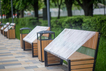 Park benches wrapped in connection with the coronavirus pandemic. social distance, forbidden to sit down, covid-19