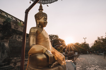 Ancient Buddhist temple at sunset in Chiang Mai, Thailand 