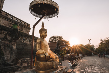 Ancient Buddhist temple at sunset in Chiang Mai, Thailand 