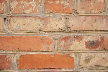 old crumbling abandoned brick wall. close up view