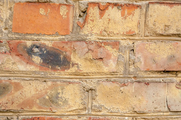 old crumbling abandoned brick wall. close up view