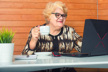 Woman in quarantine for Coronavirus works at home.Drinking a cup of coffee.	