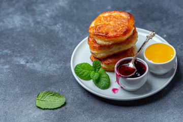 Traditional pancakes with jam and honey.