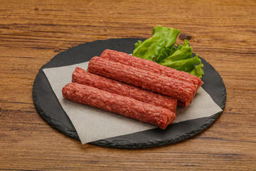 Raw beef sausages with spices