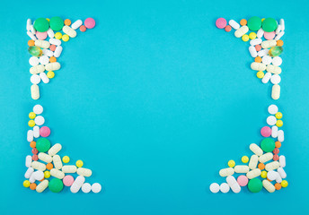 Mockup of colorful pills on blue background