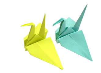 yellow and blue origami birds on white background