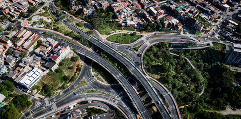 Medellín, Antioquia/Colombia; January 01, 2020: Aerial view of "Puente de la Madre Laura" in the north of the city of Medellin. Houses, buildings and the northern highway.