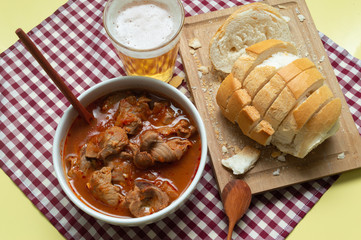 tasty and tradicional brazilian snack bar: gizzard, bread and cold beer.