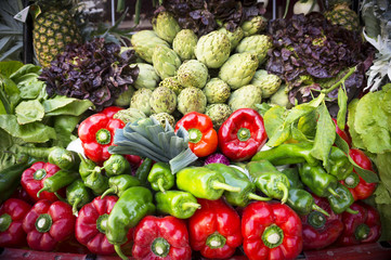 Vegetable stand with peppers and artichokes