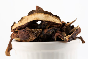 Dried wild mushrooms in a small bowl