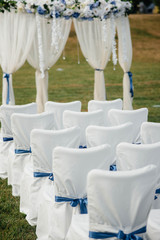 Beautifully decorated and arranged chairs for a festive Banquet. Decor, wedding