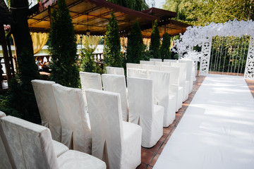 Beautifully decorated and arranged chairs for a festive Banquet. Decor, wedding