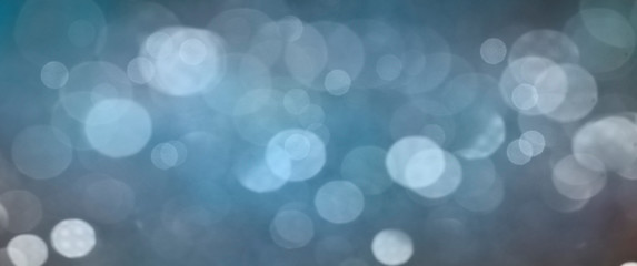 Christmas light background.  Holiday glowing backdrop. Defocused Background With Blinking Stars. Blurred Bokeh.