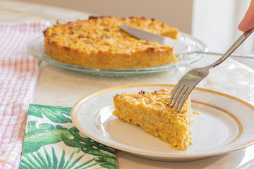 Homemade Roasted vegetable quiche pie with a wedge cut out. Delicious vegetarian food. freshly...