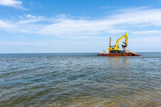 Backhoe on a barge on Lake Michigan