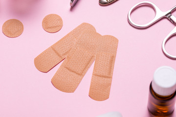 Set of adhesive bandage, medical sticking plaster on pink background