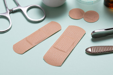 Set of adhesive bandage, medical sticking plaster on green background