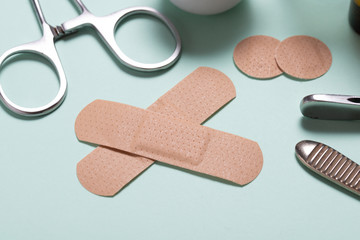 Set of adhesive bandage, medical sticking plaster on green background