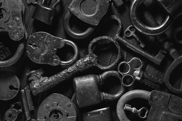 Vintage keys and padlocks. Background from retro items. Top view, flat layout