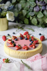 Low Fat Mousse Yogurt Strawberry and Raspberry Cheesecake set on cafe table.  Gluten Free Low-Carb Healthy Dessert.