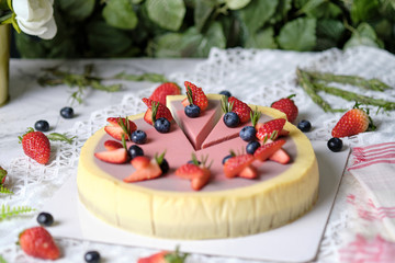 Low Fat Mousse Yogurt Strawberry and Raspberry Cheesecake set on cafe table.  Gluten Free Low-Carb Healthy Dessert.