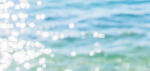 Naklejka na ściany i meble summer blurred sea bokeh beach background