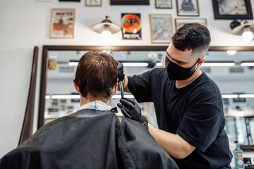 Thinning and styling hair. Hairdresser makes a haircut to the client. 