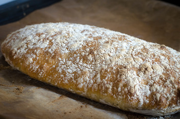 Italian ciabatta bread sliced on a board
