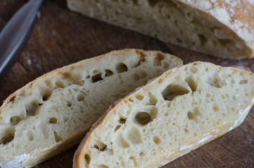 Italian ciabatta bread sliced on a board