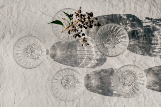 Glassware with reflections and flowers